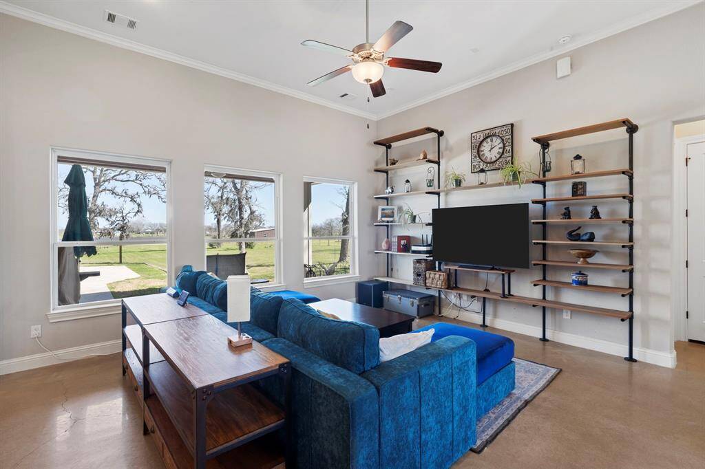 A wall of windows offers stunning views of the property.