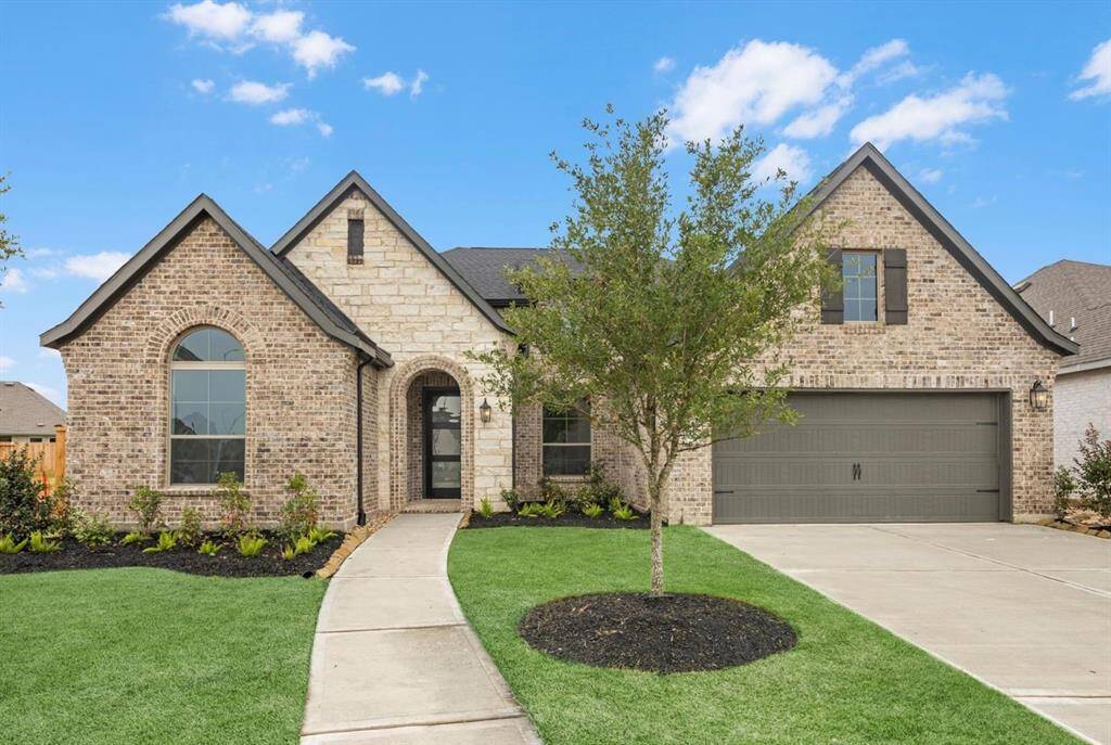 MOVE IN READY!! Westin Homes NEW Construction (Lindy, Elevation A) One story. 4 bedrooms. 3.5 bathrooms. Green grass added to enhance photo.