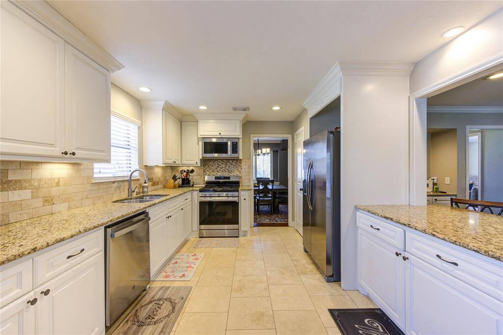 Beautifully updated kitchen with stainless appliances and granite countertops!