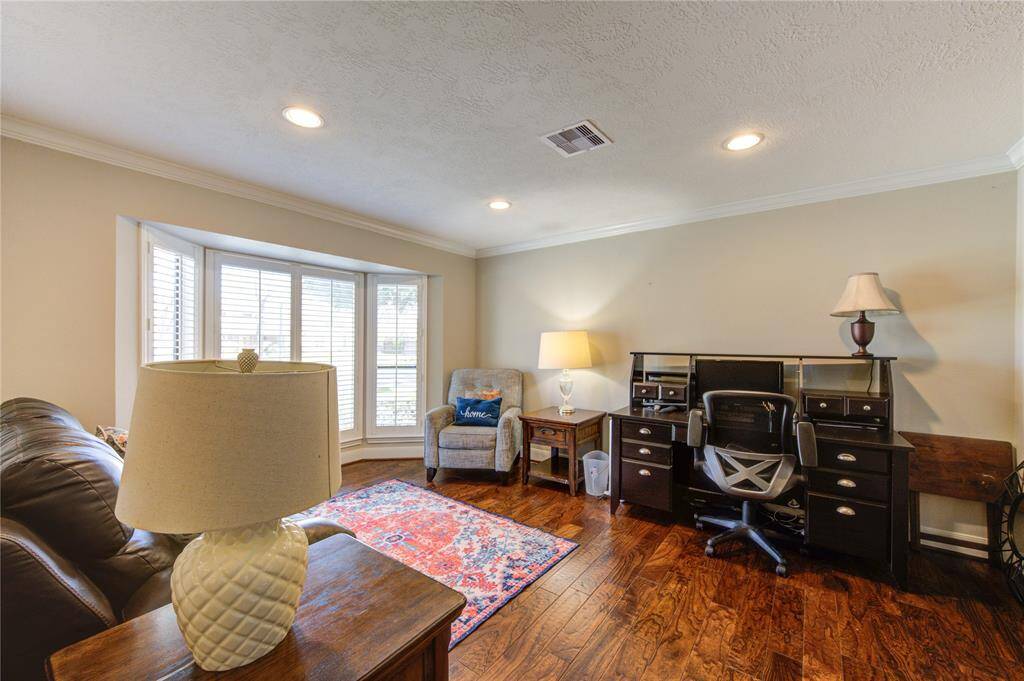 Formal living, currently used as an office/sitting area.