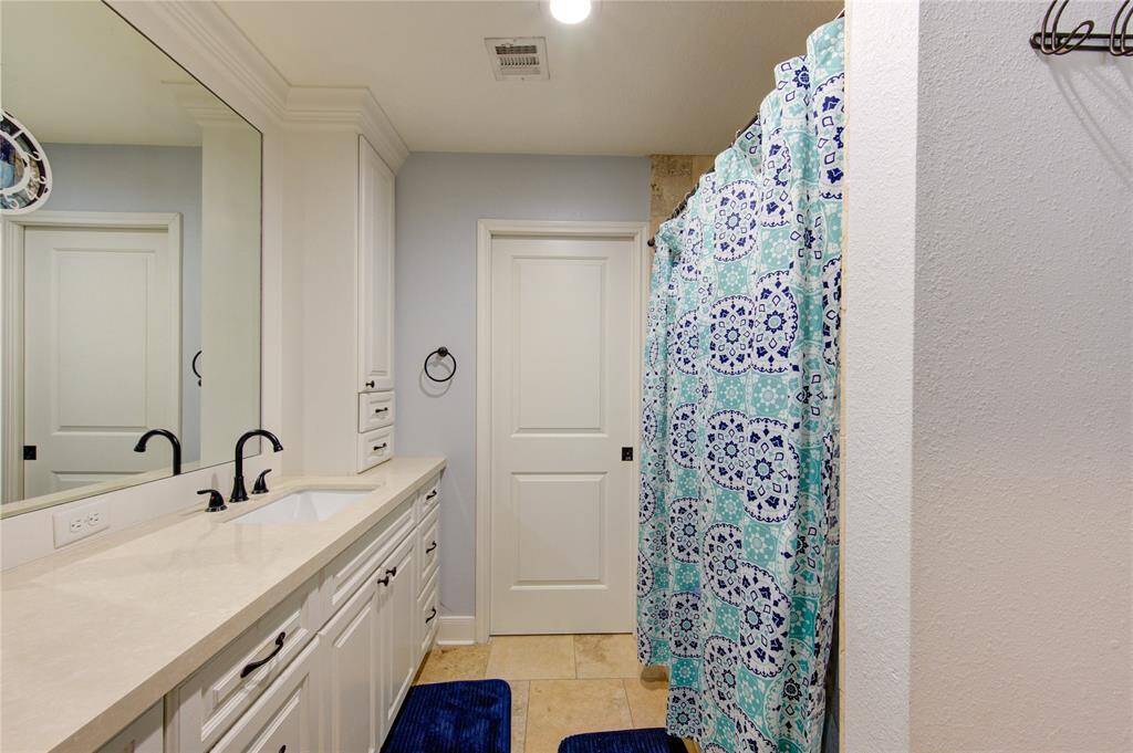 Primary bathroom with soaking tub on right.