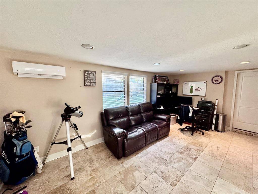 Bonus room currently being used as an office and entertaining space.