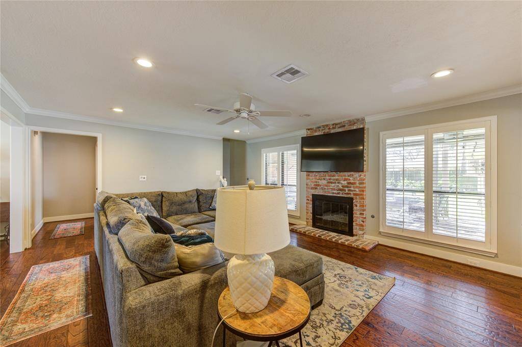 Family room - primary suite on left. Stairs center.