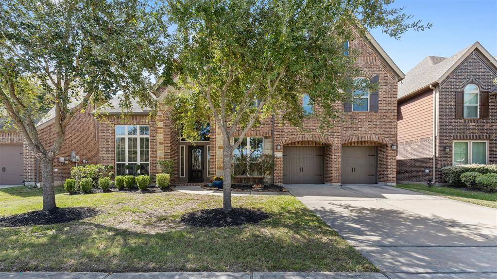 Welcome home to your beautiful landscape front yard with mature trees set just beyond your shaded front porch.