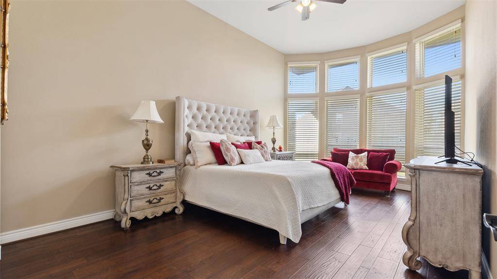 Retire to your king sized bedroom with warm wood floors, floor to ceiling curved double layered windows!