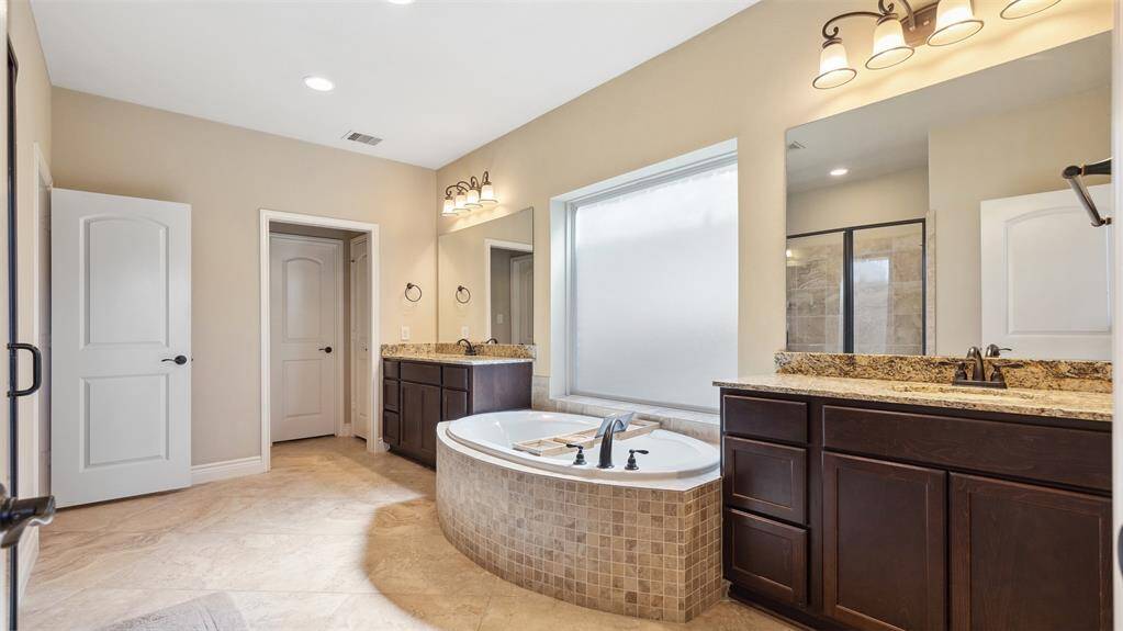 Oversized soaking tub to wash the dress away at the end of your day
