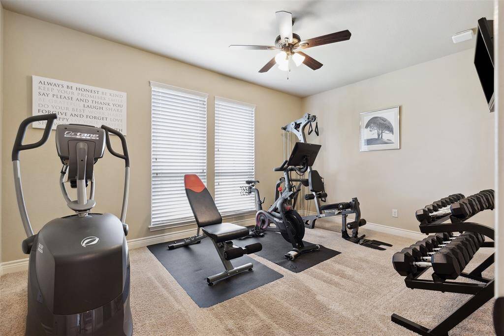 1st Floor Mother-in-Law Suite or Guest Suite with an Ensuite Bath staged as home gym.