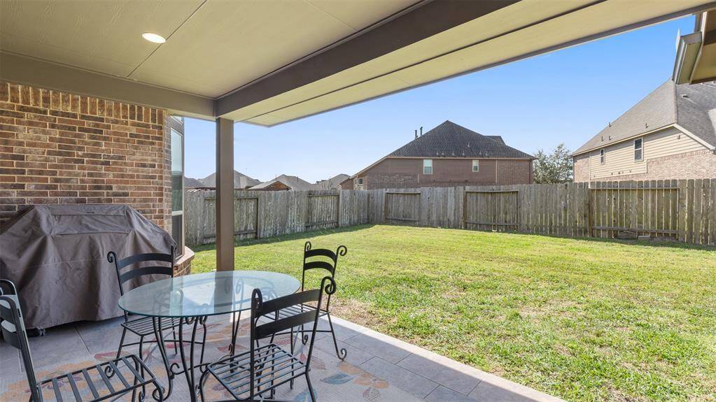 Relaxing covered patio ready for outdoor grilling!