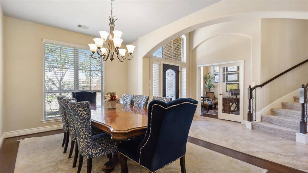 Spacious formal dining with warm hard wood flooring easily sits 8-10.