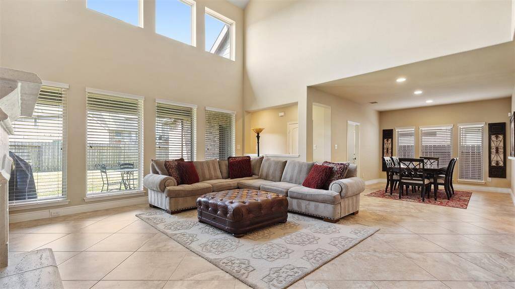 Family room, bathed in light keeps the family together with an adjoining kitchen and breakfast area.