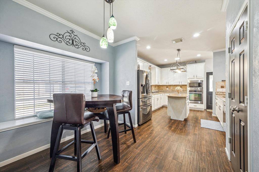 Breakfast nook with table and chairs that can stay with the home