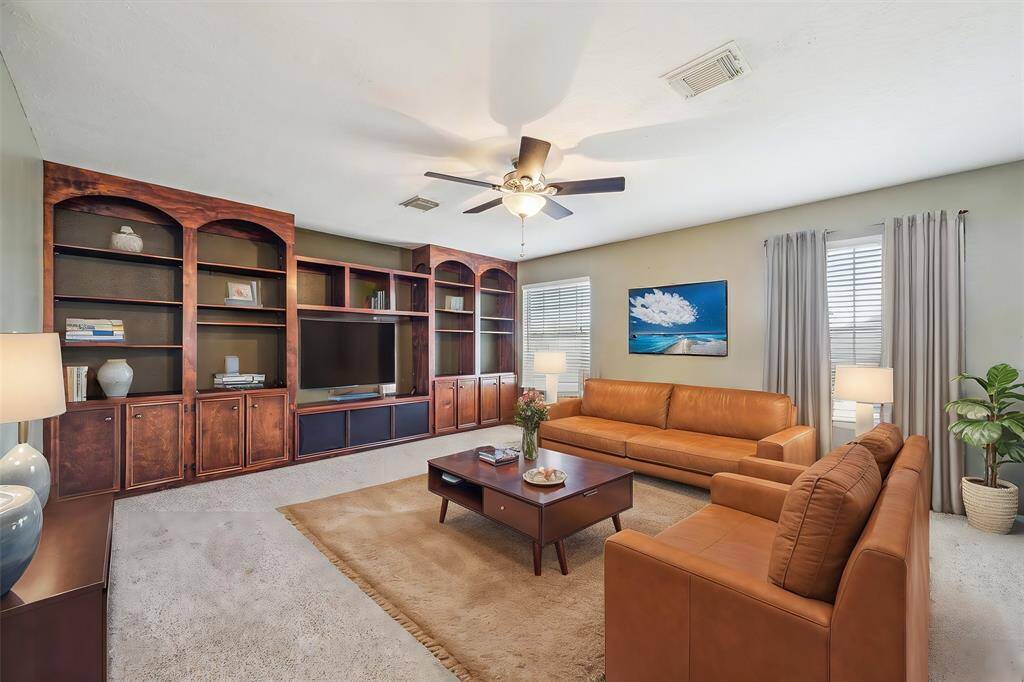 Large upstairs loft perfect for a game room or second living area. Virtually staged.