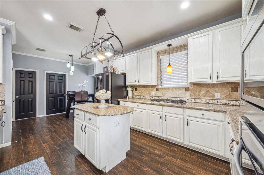 Spacious kitchen with updated appliances and island