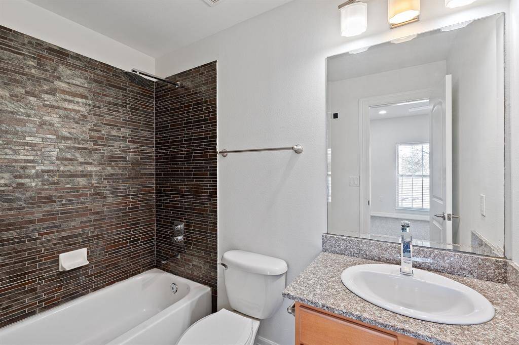 The primary bedroom also has an en-suite bathroom and walk-in closet.