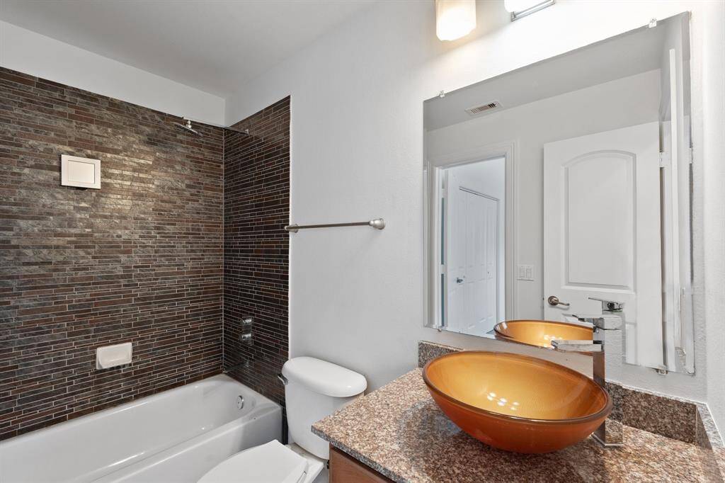 Secondary bedroom also has a large window and en-suite bathroom.
