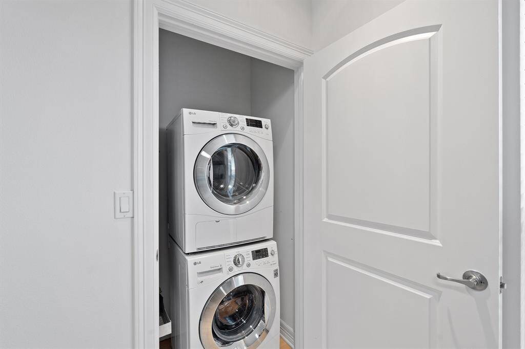 The secondary en-suite bathroom has a tub and shower combo with tile surround and modern vessel sink.