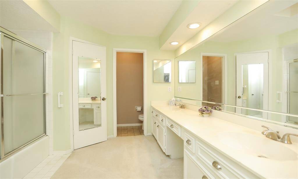 Primary bath has dual vanities for plenty of room.