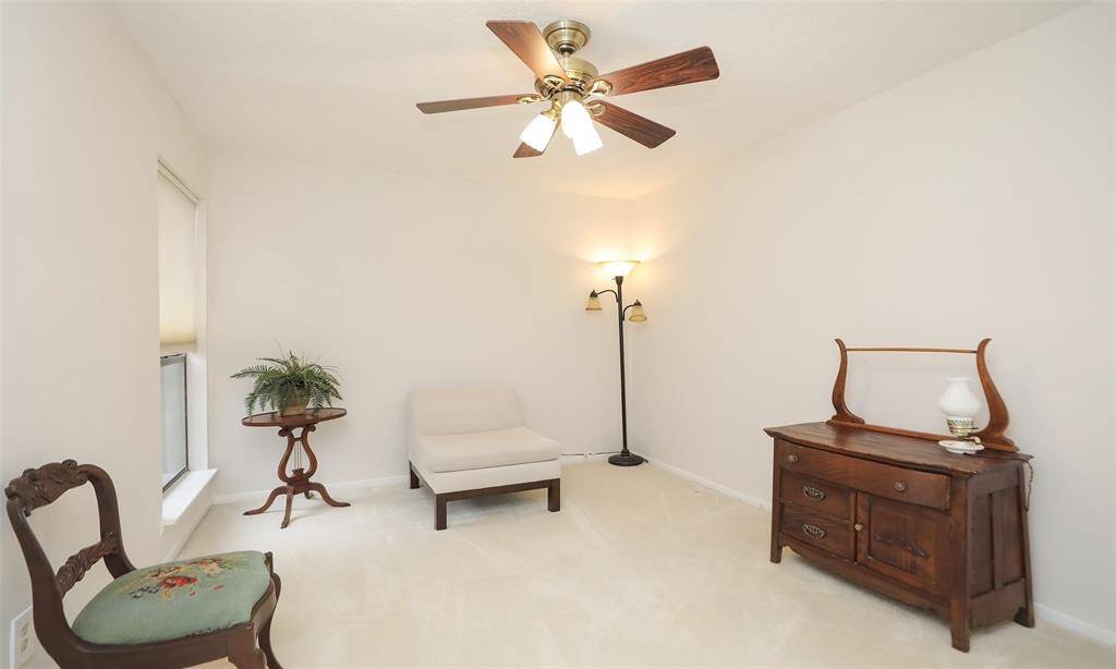 Secondary bedroom 2 is located at the end of the hall and lots of room for a large bed and has a large walk in closet