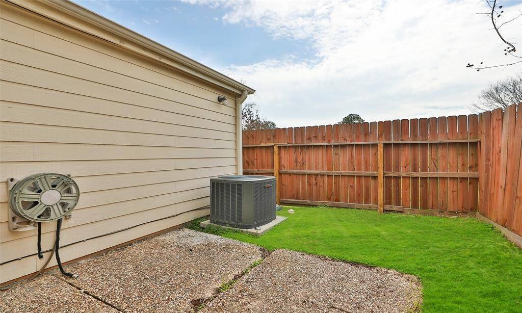 Side yard with well maintained grass.