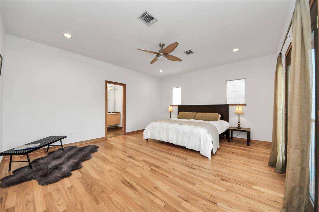Largest secondary bedroom located on the second floor has Juliet, French doors, that overlooks the courtyard