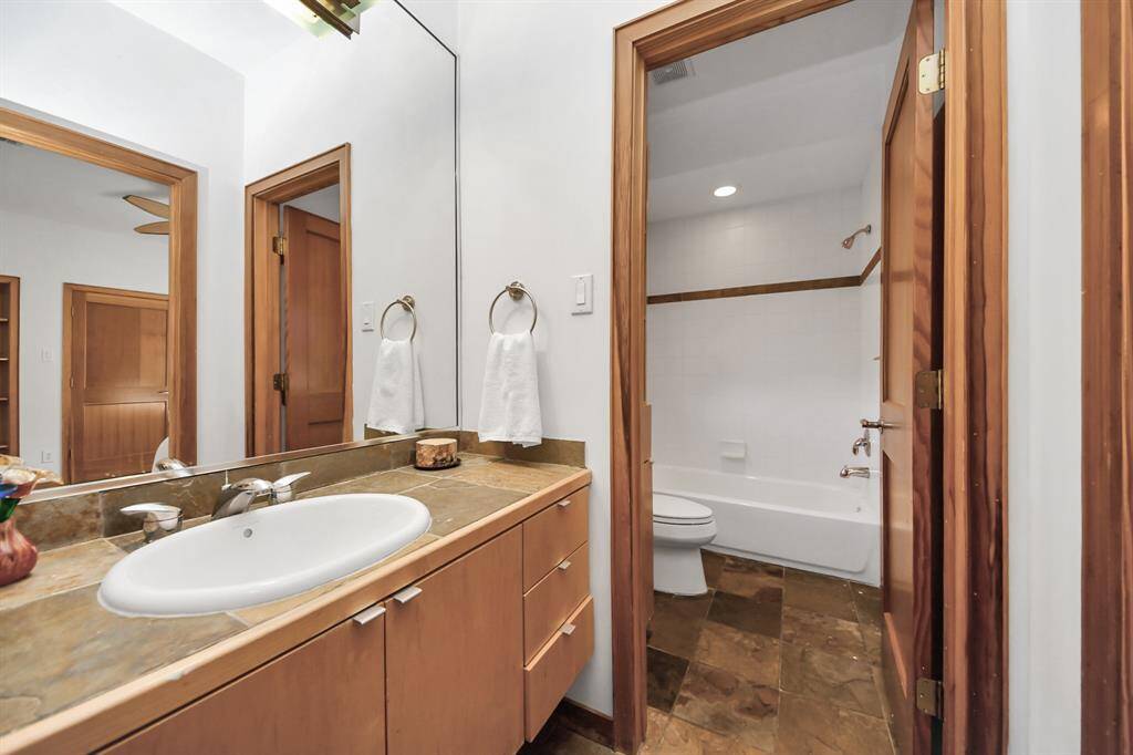 Full bath located between secondary bedroom and game room/flex space