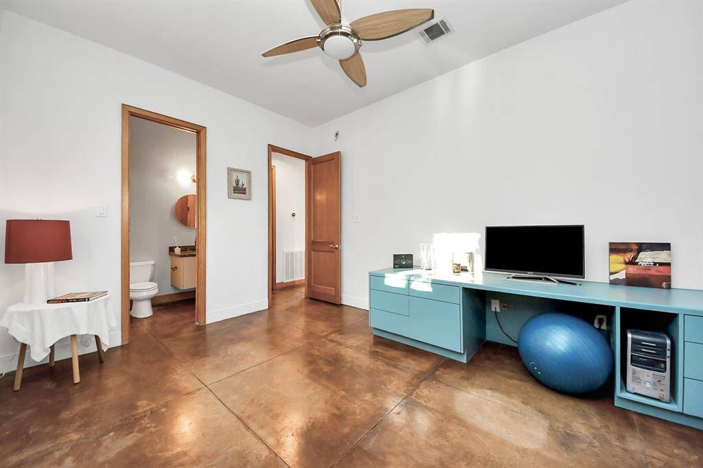 Secondary bedroom on the first floor looking into attached full bath