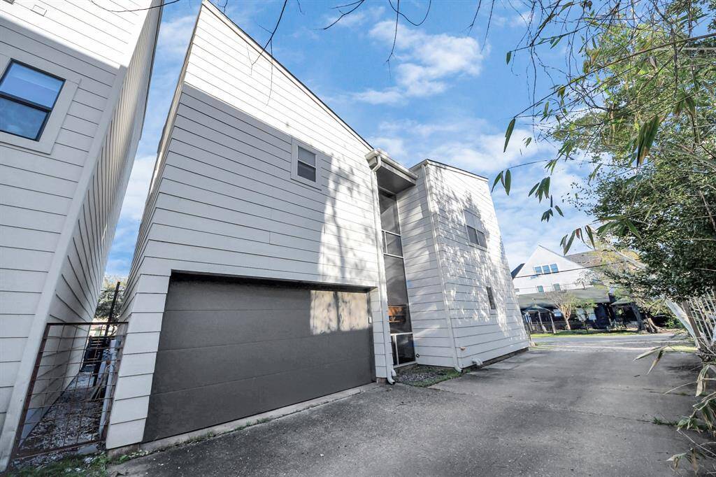 The 2 car garage is located at the back of the home via paved driveway