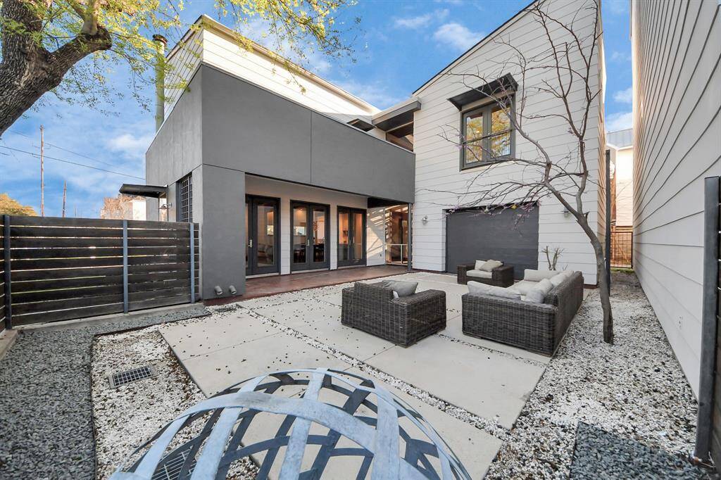 Enter the home via any of the 3 brand NEW glass French doors from the courtyard. Hearts of redbud tree is starting to bloom now and is so beautiful when foliage is completely grown in!