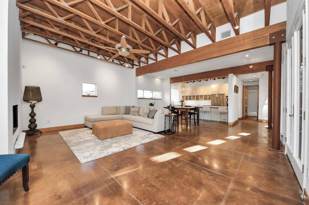 Exposed beams and trusses on the first and second floor. The open floorplan with uninterrupted views is also great for entertaining guests inside.