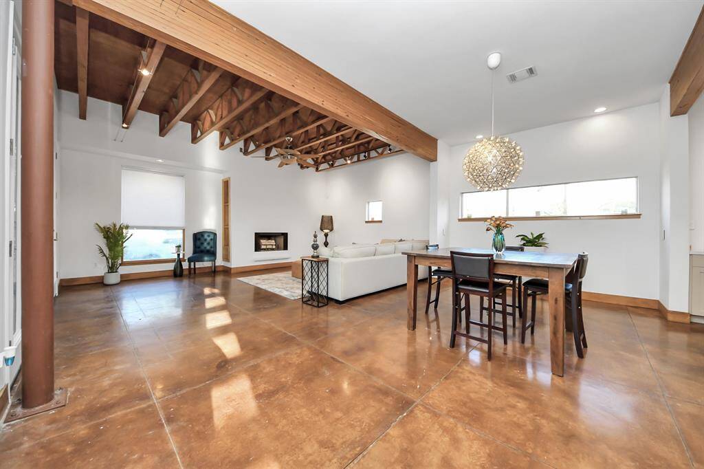 Open dining area will easily accommodate 8 chairs and dining table. The dimmable chandelier is definitely an impressive feature