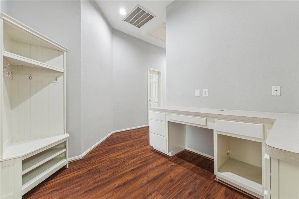 Located outside the bedrooms is this workspace area, perfect for the kids or to be used as a Home Office area. Mud Area located here too.