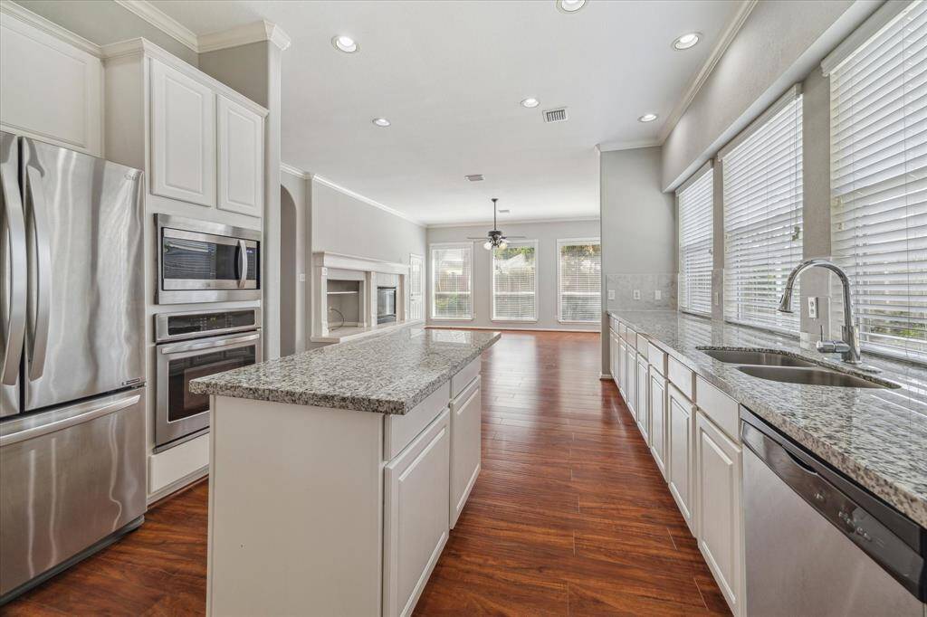 The Kitchen, the main hub of the home, shows off the ideal open concept allowing you not to miss a second of action.