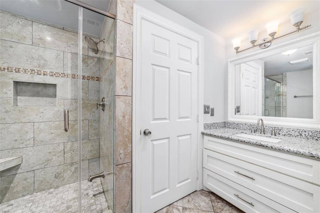 Fully renovated primary bathroom with double vanity.