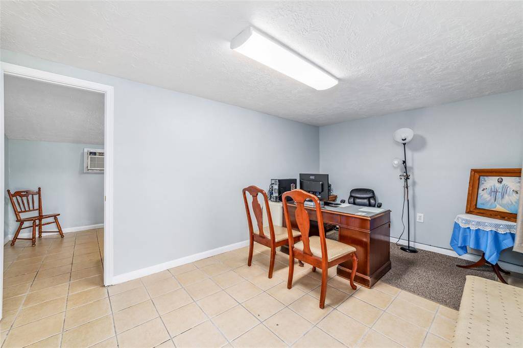 1st level apt, the front room is currently used as office space.