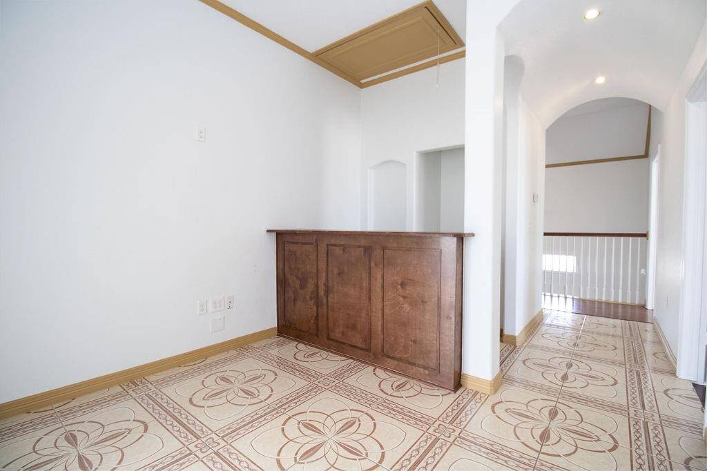 Upstairs sitting area with dry bar, leads out to roof deck.