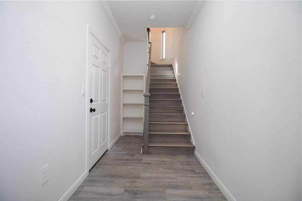 Entrance to garage, door on the left and upstairs is the 1 bedroom guest apartment.