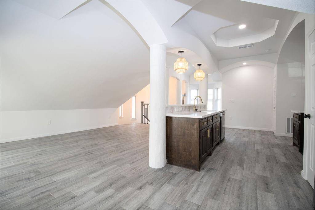 Guest apartment kitchen, opens up to living area or dining, lots of choices, lots of bright light.