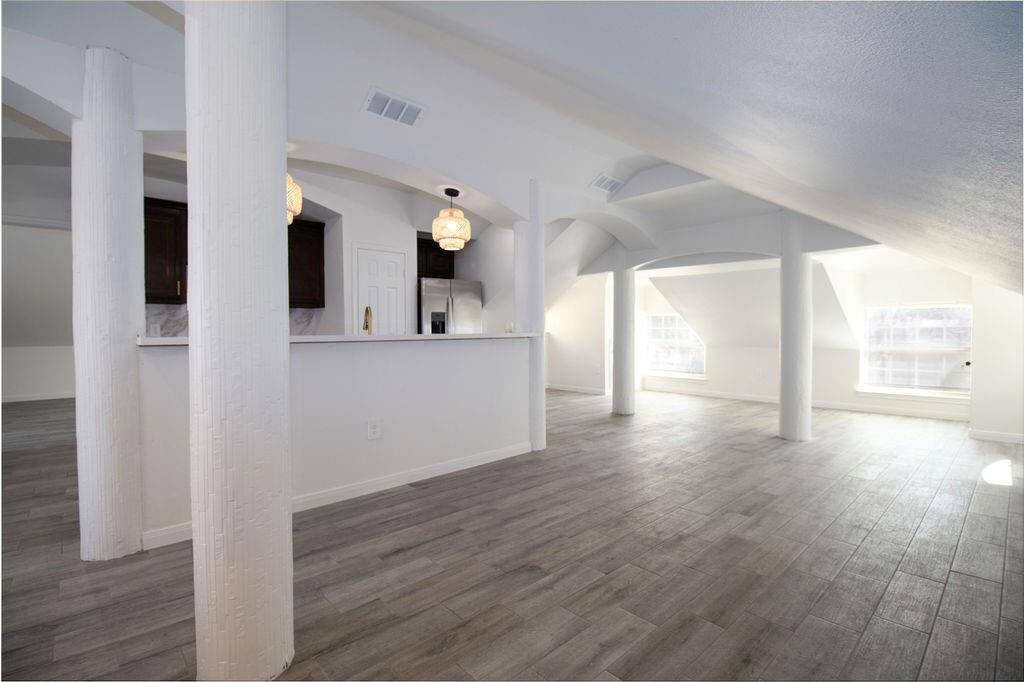 This is a view from the entrance to the Guest Apartment, showcases the front of the kitchen, living area in front and to the side, lots of light!