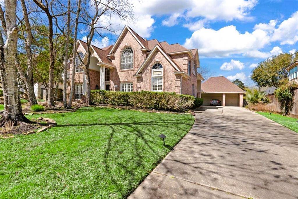 Stunning brick home with mature landscaping with 3-car garage and porte cochere located in a cul de sac with greenbelt access. The greenbelt trails run over 75 miles throughout the Kingwood community.