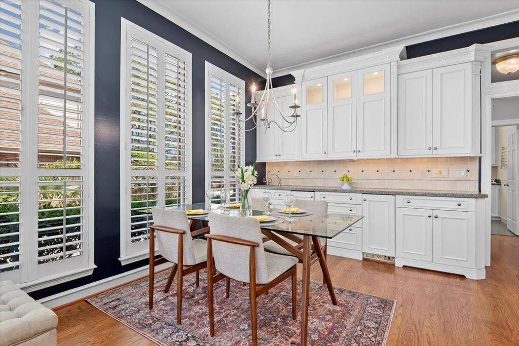Spacious breakfast room with additional storage featuring a bar sink, separate ice maker and a built-in beverage refrigerator.