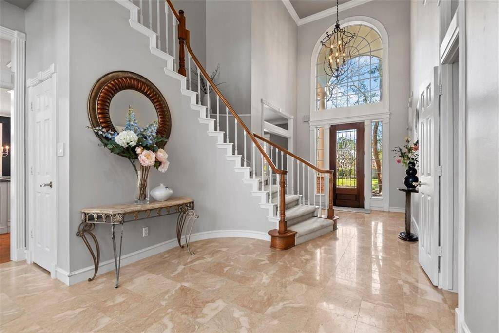 The formal dining room is located to the left of the front door and the study is on the right.