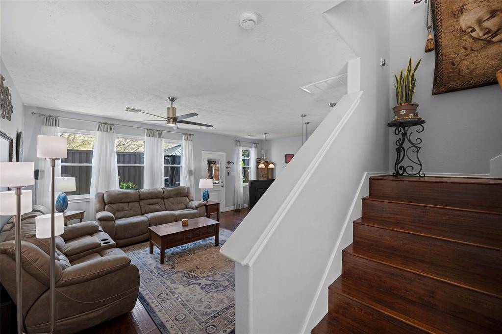 This inviting living room features elegant wood flooring, creating a warm and welcoming atmosphere.
