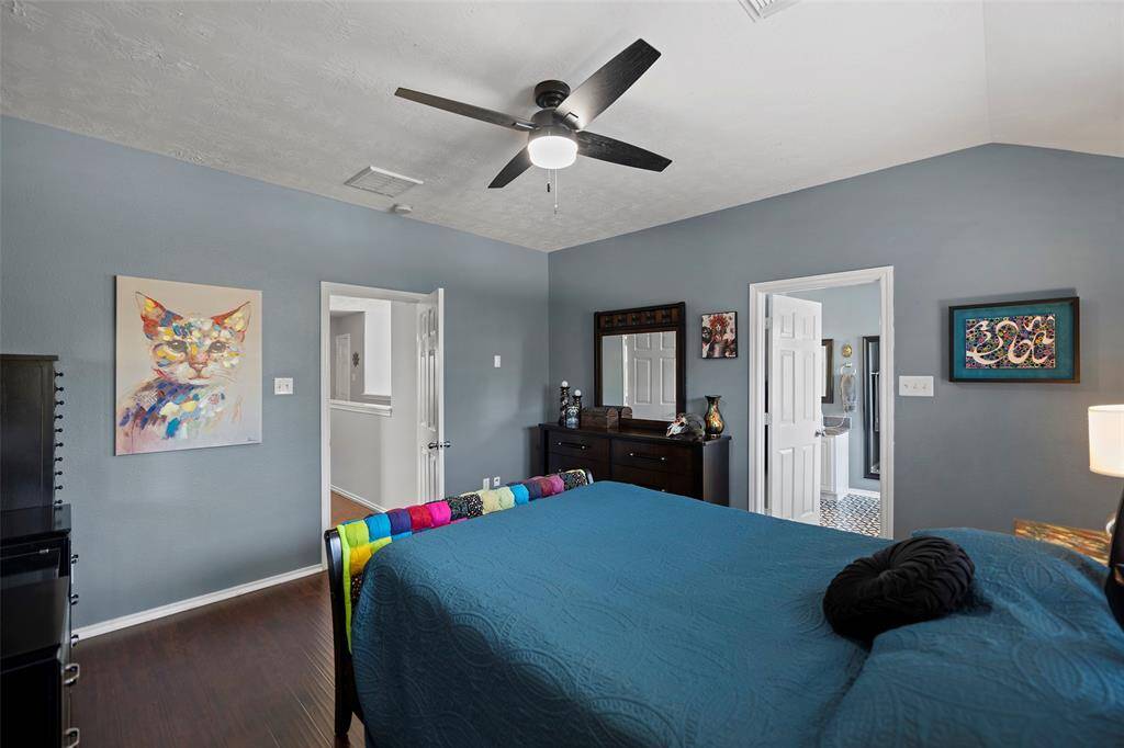 A second view of the Primary bedroom with access to the bathroom, enhancing convenience and functionality.