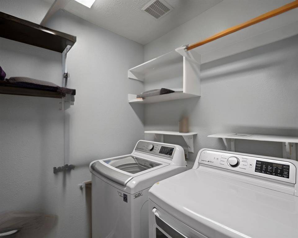 Spacious Laundry Room with shelves