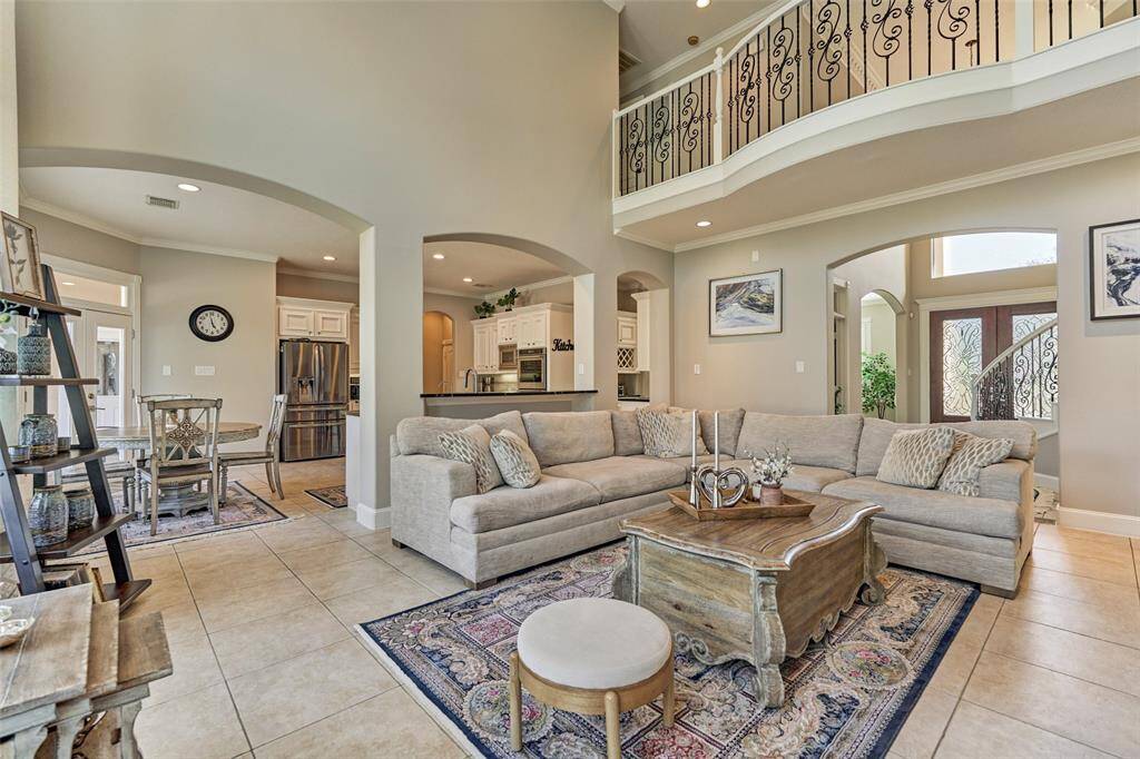 Experience seamless living with this spacious open-concept design, featuring a stylish living room, modern kitchen, and charming breakfast area.
