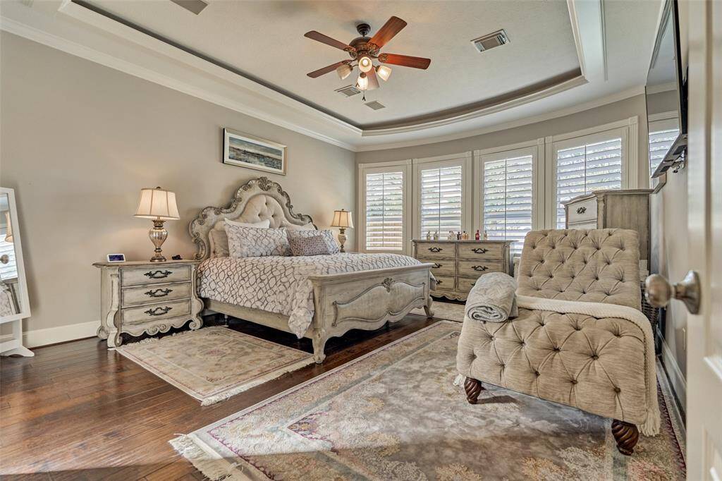 Wake up to stunning backyard views in this spacious primary bedroom, your perfect relaxing retreat.