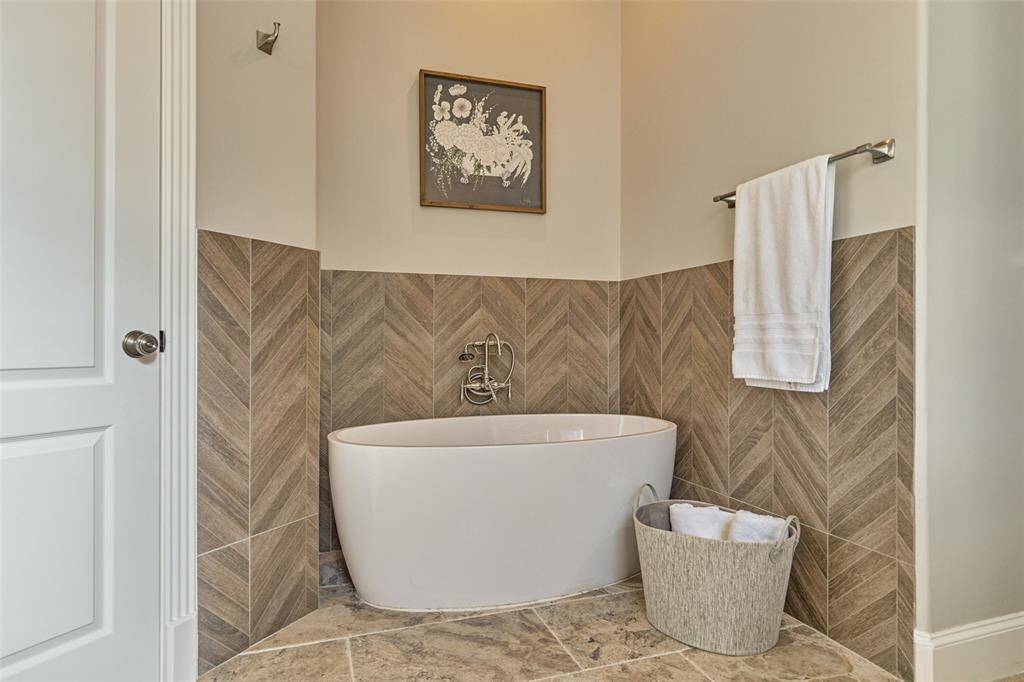 Luxurious bathroom featuring a sleek freestanding tub.
