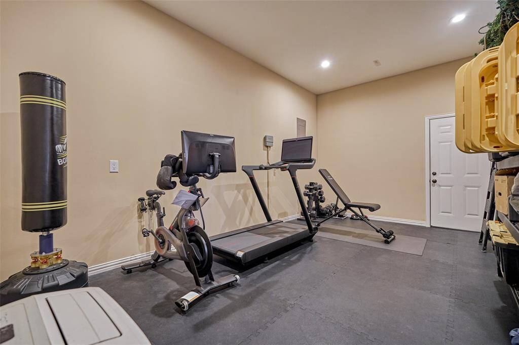 Discover the expansive home gym, perfect for all your fitness needs.