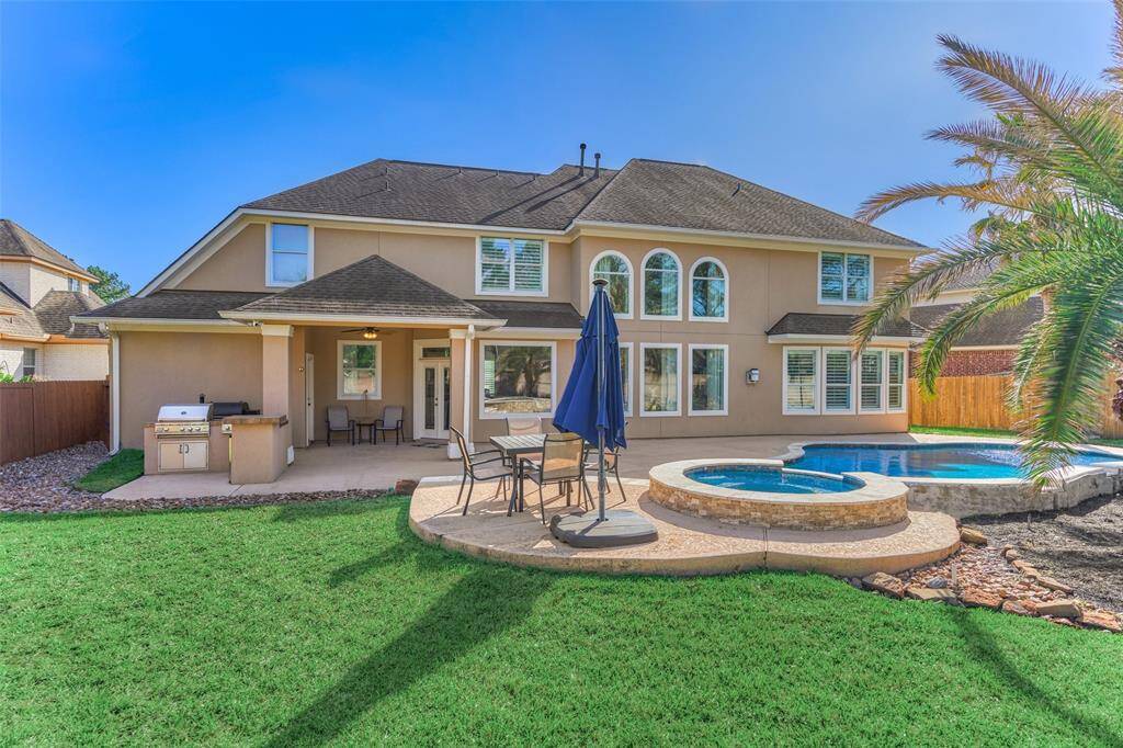 Relax and unwind in your new home, featuring a spacious yard perfect for outdoor enjoyment.