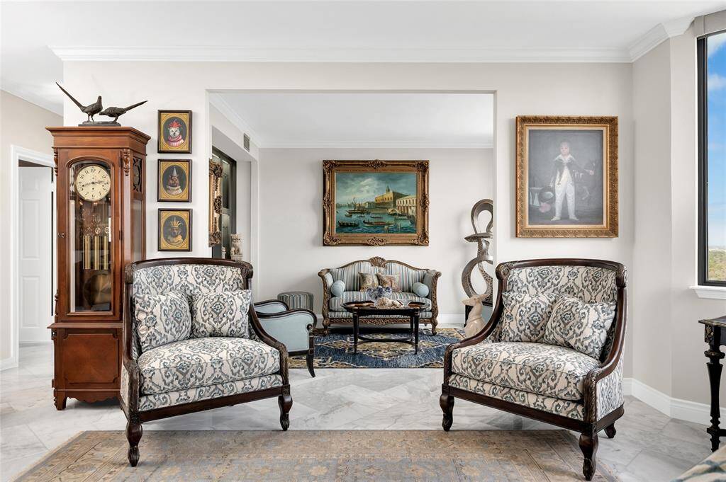This cozy and versatile den extends effortlessly from the living room, creating a perfect space for relaxation or entertainment. The large openings provide a seamless flow, allowing natural light to brighten both areas.